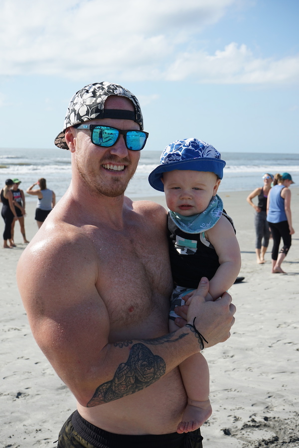 Man and baby on beach