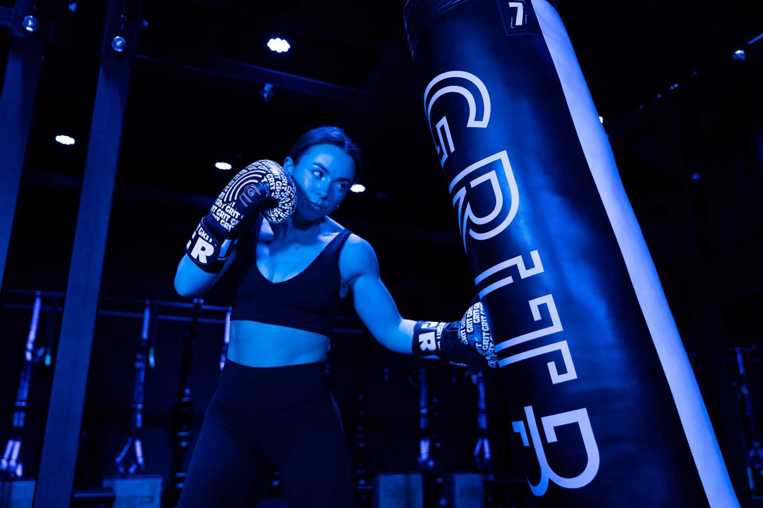 Coach Kelly at the kickboxing bag inside the Charlotte studio