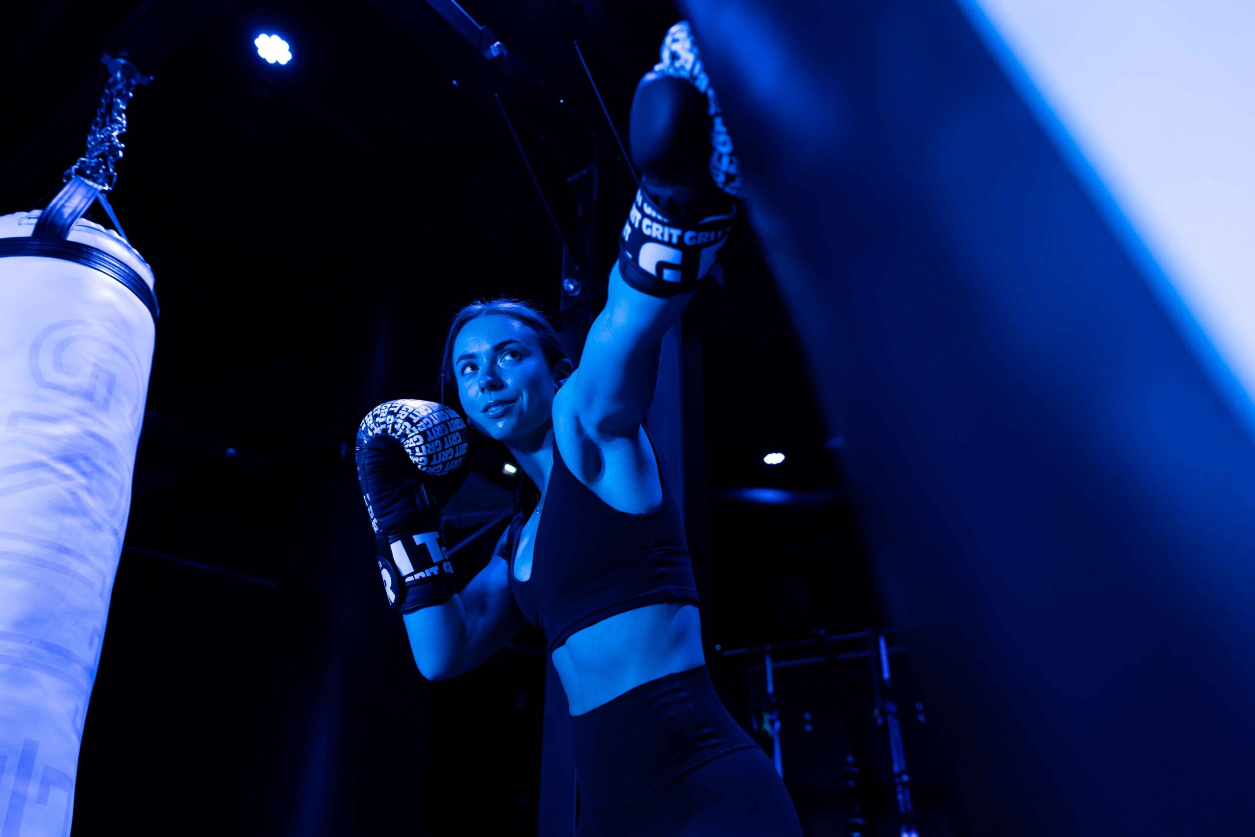Coach Kelly hitting the bag with gloves on.